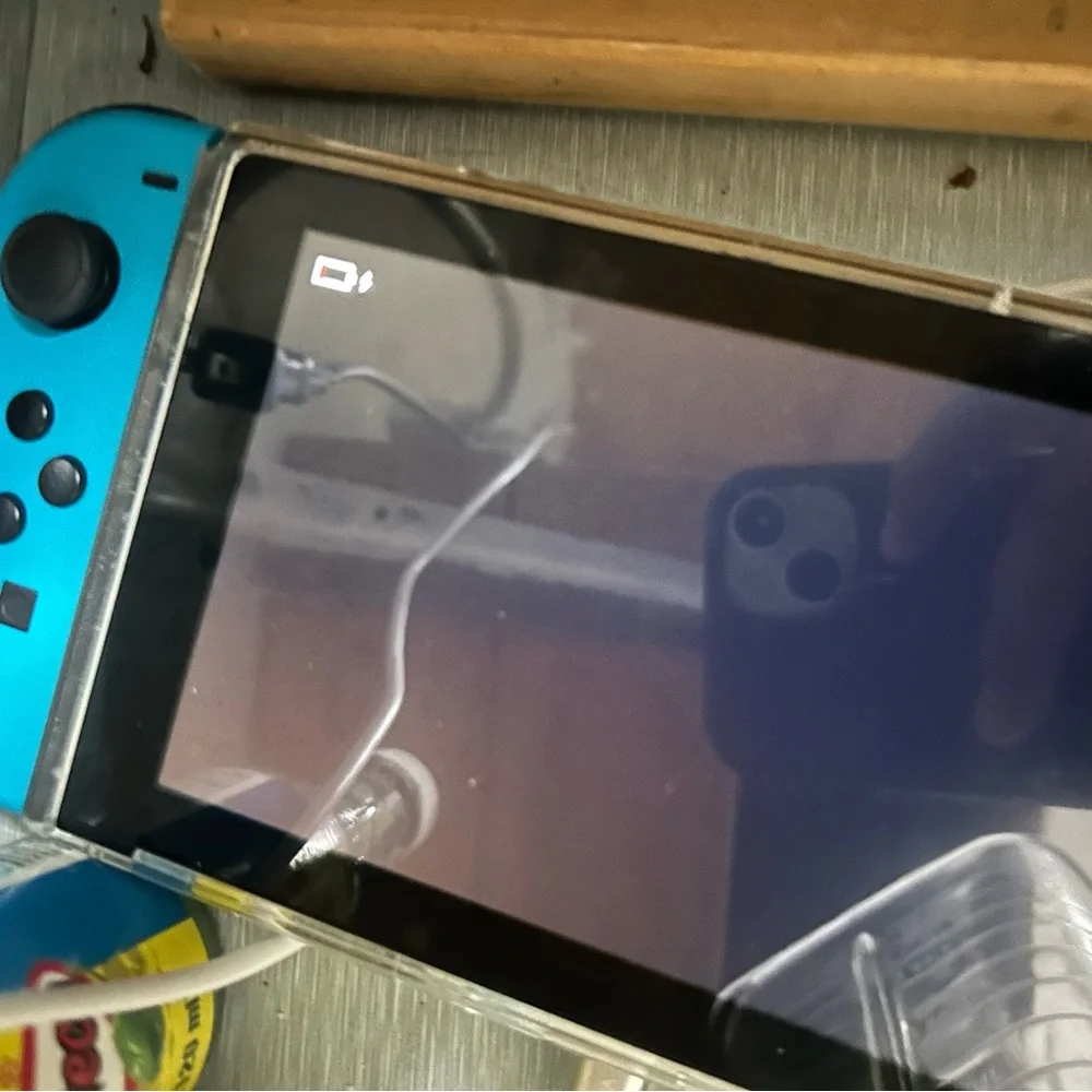 Nintendo Handheld Console with Red and Blue Controllers